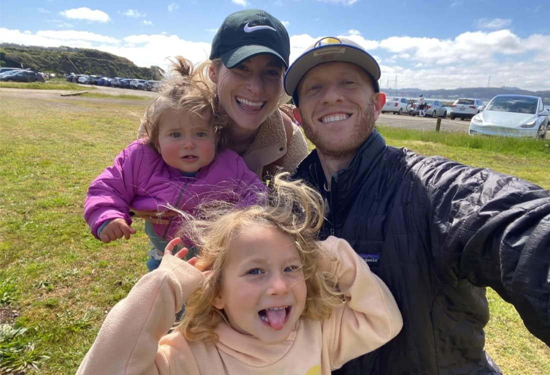 Danny and Danielle Orlick, NetGym’s founders, taking a selfie with their two young daughters outdoors