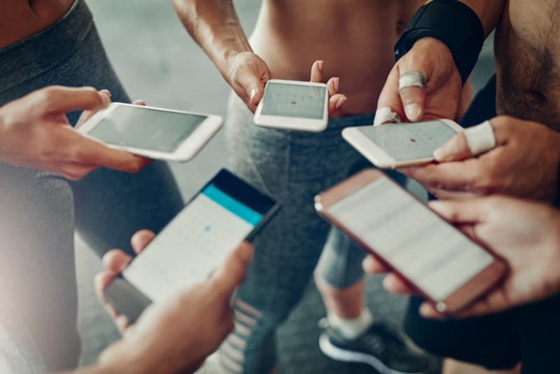 Two people comparing messages on their phones